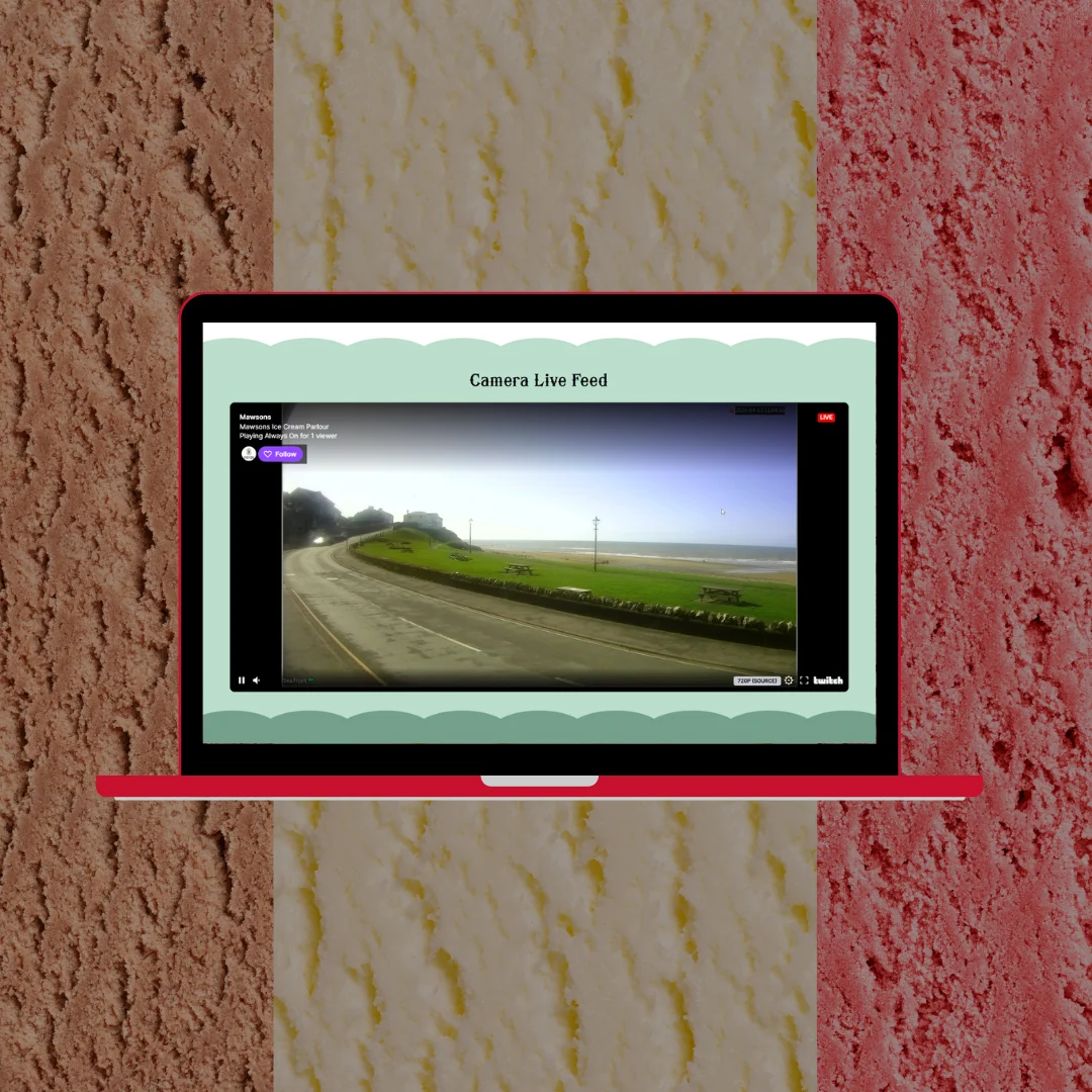 Laptop showing the Mawsons Ice Cream Parlour website camera live feed section with a Twitch live stream of a coastal Cumbrian road scene, set against a background of colourful ice cream scoops