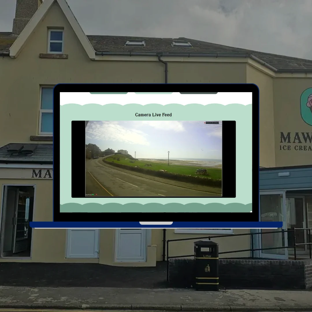 Mawsons Ice Cream Parlour website CCTV live camera stream page on laptop showing Twitch live feed of coastal Cumbrian road
