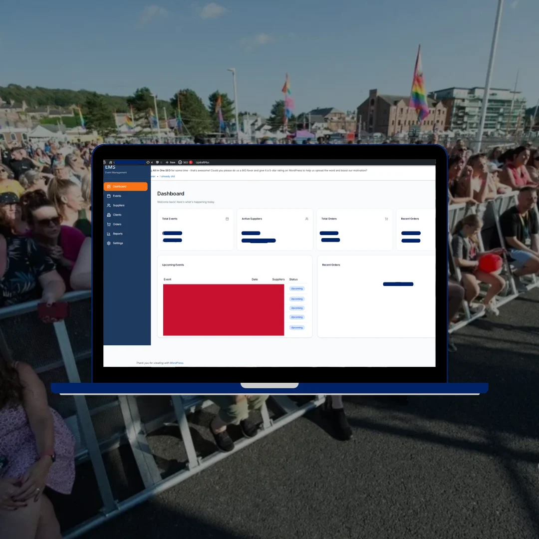 Lakeland Life events management admin dashboard on blue laptop at Pride by the Harbourside festival Whitehaven