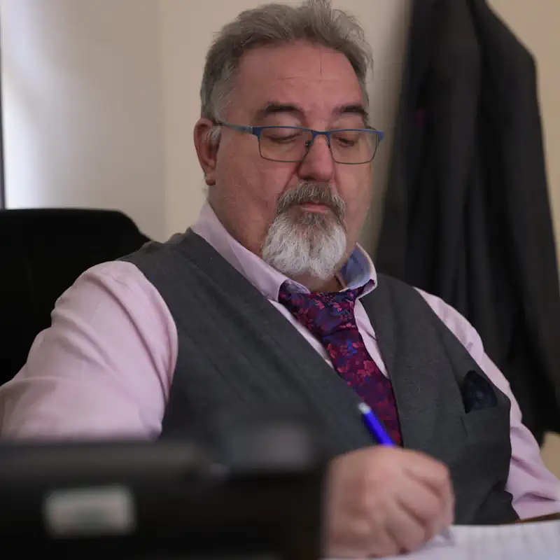Bill working at a desk